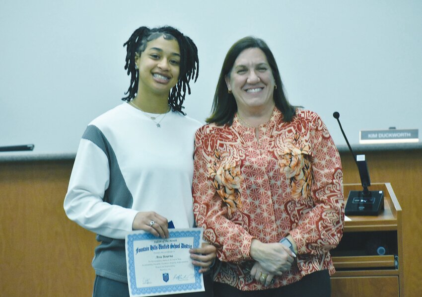 Fountain Hills Unified School District faculty and students were recognized as part of &ldquo;District Celebrations&rdquo; at the March 19 FHUSD Governing Board meeting. Fountain Hills High School Principal Barrie Pinto, right, acknowledged the contributions of student-athlete Ava Bourne.