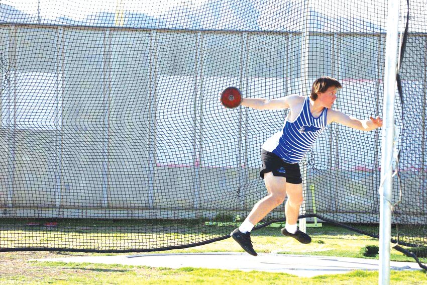 Fountain Hills junior Nathan Melloy spins as he prepares to throw the discus during a meet earlier this season.