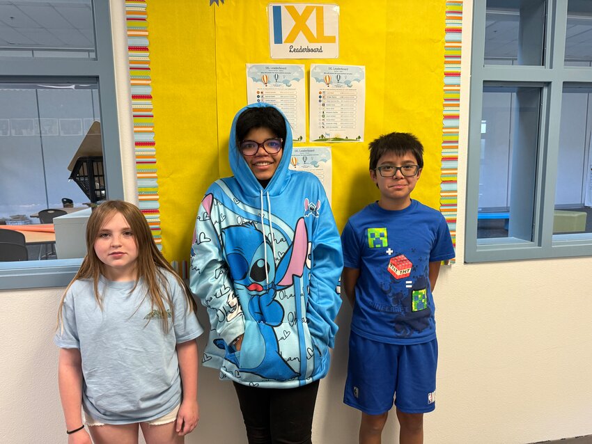 Four Peaks Chapter National Society Daughters of the American Revolution recently announced its fifth grade American History Essay winners from McDowell Mountain Elementary School. Pictured from left, third place winner Keeva Swan, second place winner Bianca Harper and first place winner Hamza Bittar.