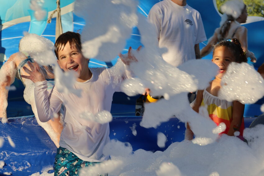 Kids cool off in the foam pit during a summer event in Fountain Hills.