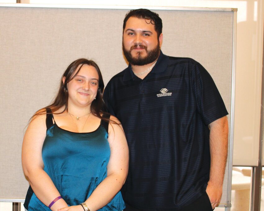 Emma Comeau receives the Boys &amp; Girls Club of Greater Scottsdale Community Service/Leadership scholarship from Eddie Delgado. Senior recognition night was held Wednesday, April 30, in the Fountain Hills Community Center. )