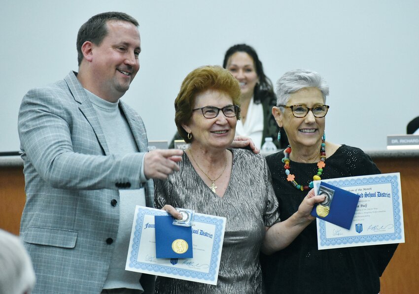 Little Falcons Preschool custodian Milica Bulj, center, poses with Fountain Hills Unified School District Superintendent Cain Jagodzinski, left, and preschool director Denise Matus during &ldquo;District Celebrations&rdquo; at the April 16 FHUSD Governing Board meeting. Bulj, who is retiring this year, was also named district employee of the month.