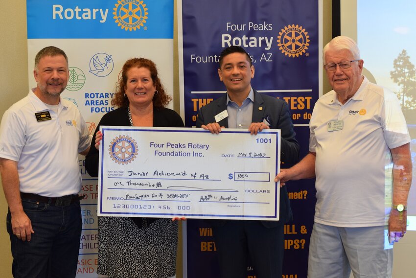 The Four Peaks Rotary Foundation recently awarded a $1,000 grant to Junior Achievement Arizona at the club&rsquo;s regularly scheduled meeting Thursday, May 8. Pictured from left: Foundation president Scott Sommer, JAA board member Theresa Conti, JAA VP of Development Will Abbott and Four Peaks Rotary champion Roger Riggert.