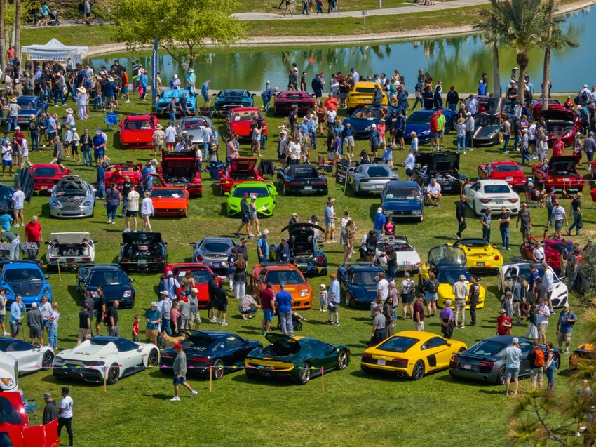 Car enthusiasts check out the vehicles on display lakeside in Fountain Hills during Concours in the Hills 2025.
