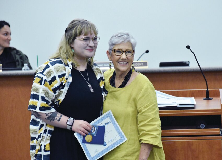 Paraprofessional Savannah Hoover, left, poses with Fountain Hills Unified School Director Denise Matus during &ldquo;District Celebrations&rdquo; at the  May 7 FHUSD Governing Board meeting.