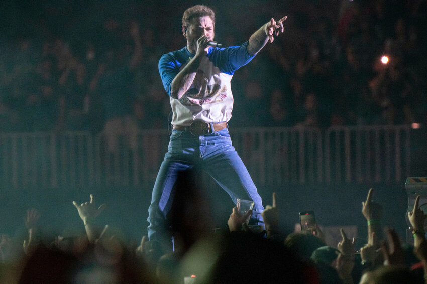Post Malone performs during The BIG ASS Stadium Tour on May 11, 2025, at Mercedes-Benz Stadium in Atlanta. Post Malone will perform at State Farm Stadium in Glendale on Saturday, June 21.