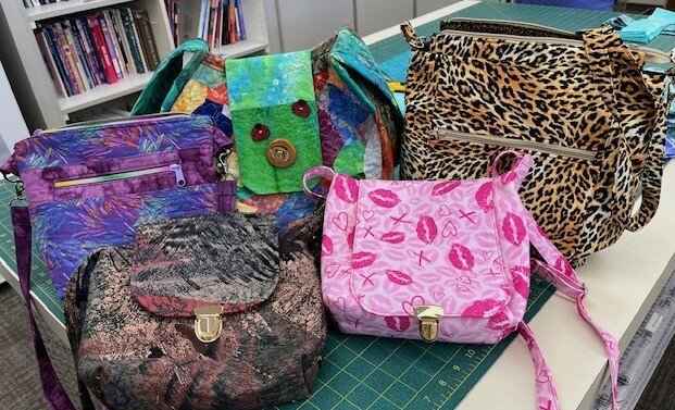 Pictured is a sampling of the purses includes Rose Waldon&rsquo;s three on the left and Robyn Reynolds&rsquo; animal print and hot-pink lips on the right.