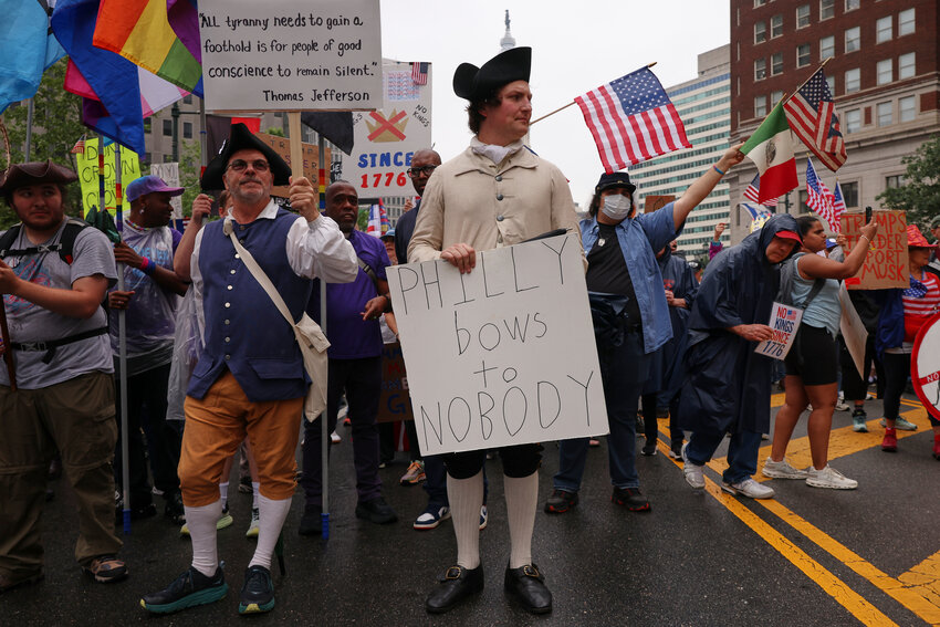Steven Pierce, center, participates in the &quot;No Kings&quot; protest, Saturday, June 14, 2025, in Philadelphia. (AP Photo/Yuki Iwamura)