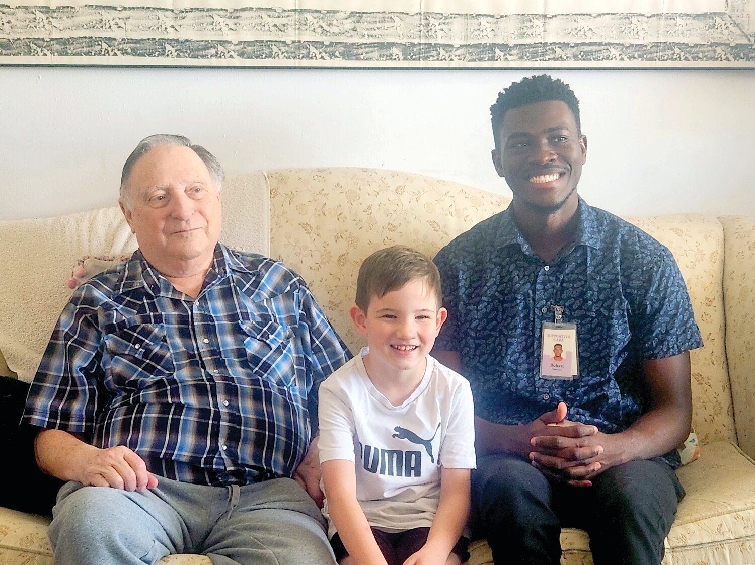 Volunteer Buhari Abdulai, right, enjoyed providing companionship to patient Bill Harris and his grandson, David. (Hospice of the Valley)