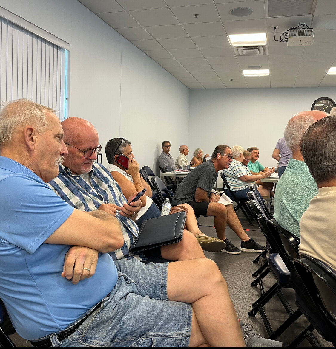 Tom Swenson (blue shirt) listens to a presentation to help decide what Sun City’s Mountain View Center will eventually look like. (Independent Newsmedia/Brent Ruffner)