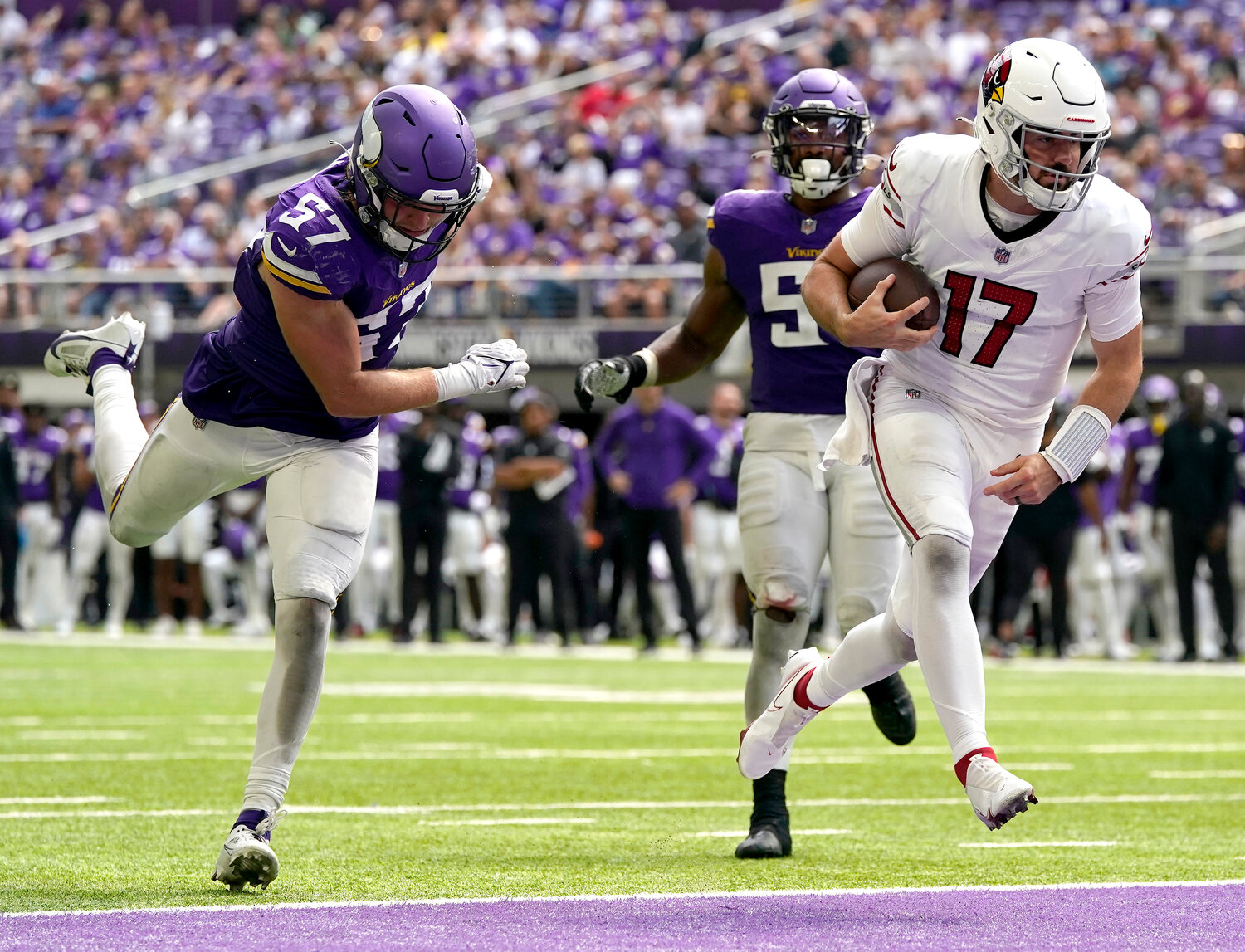 Cardinals quarterback David Blough scores a touchdown against the Vikings during the second half of their preseason game Aug. 26 in Minneapolis.