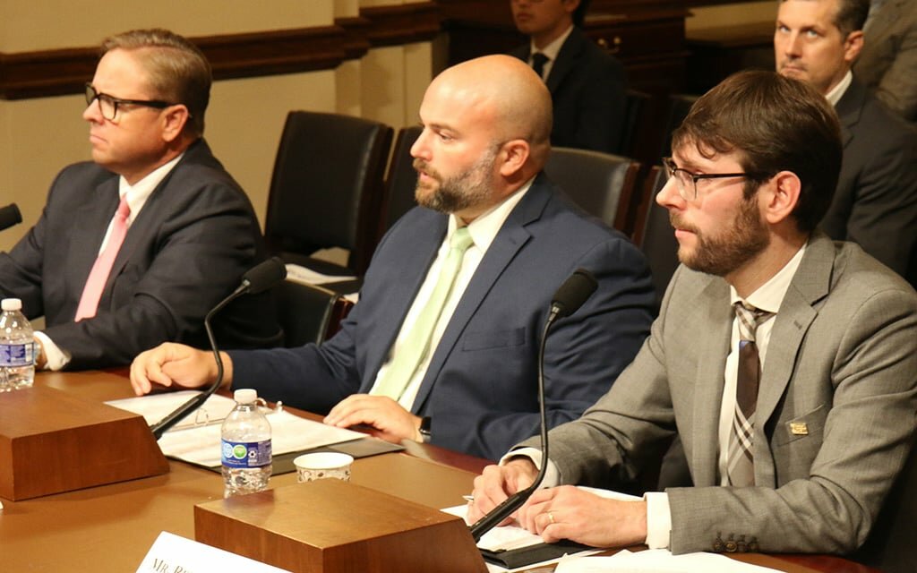 From left, Yuma County Supervisor Jonathan Lines, New York City Council member Joe Borelli and American Immigration Council policy director Aaron Reichlin-Melnick testified on the impact immigration is having on local governments’ services. (Photo by Adrienne Washington/Cronkite News)
