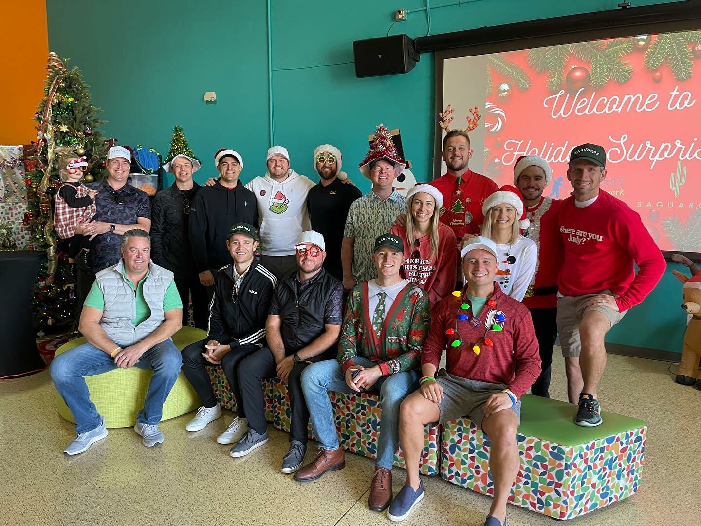 Members of The Saguaros volunteer at the 2022 Children's Cancer Network Holiday Surprises event