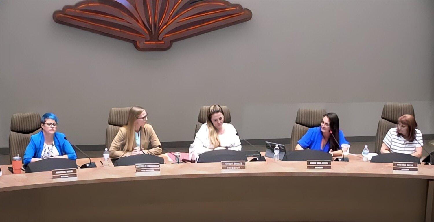 The Higley Unified School District Governing Board listens as Anna Van Hoek, second from right, discusses her problems with teachers attending certain conferences.