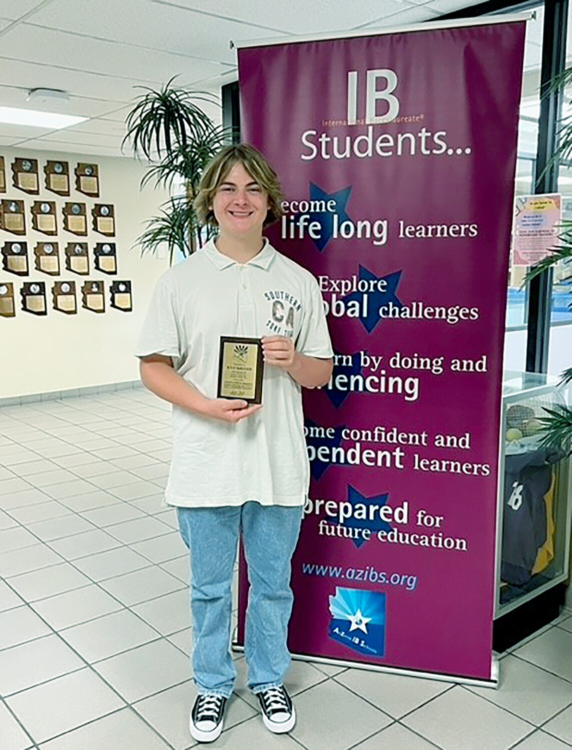 Chandler High School senior Kyle DeRosier has been named the Arizona International Baccalaureate Student of the Year. He received a plaque and a cash award at a Sept. 8 event.