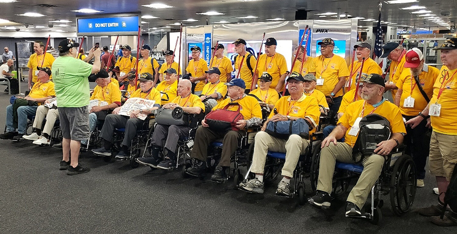 The Honor Flight veterans pose at Sky Harbor before their flight to Washington D.C.