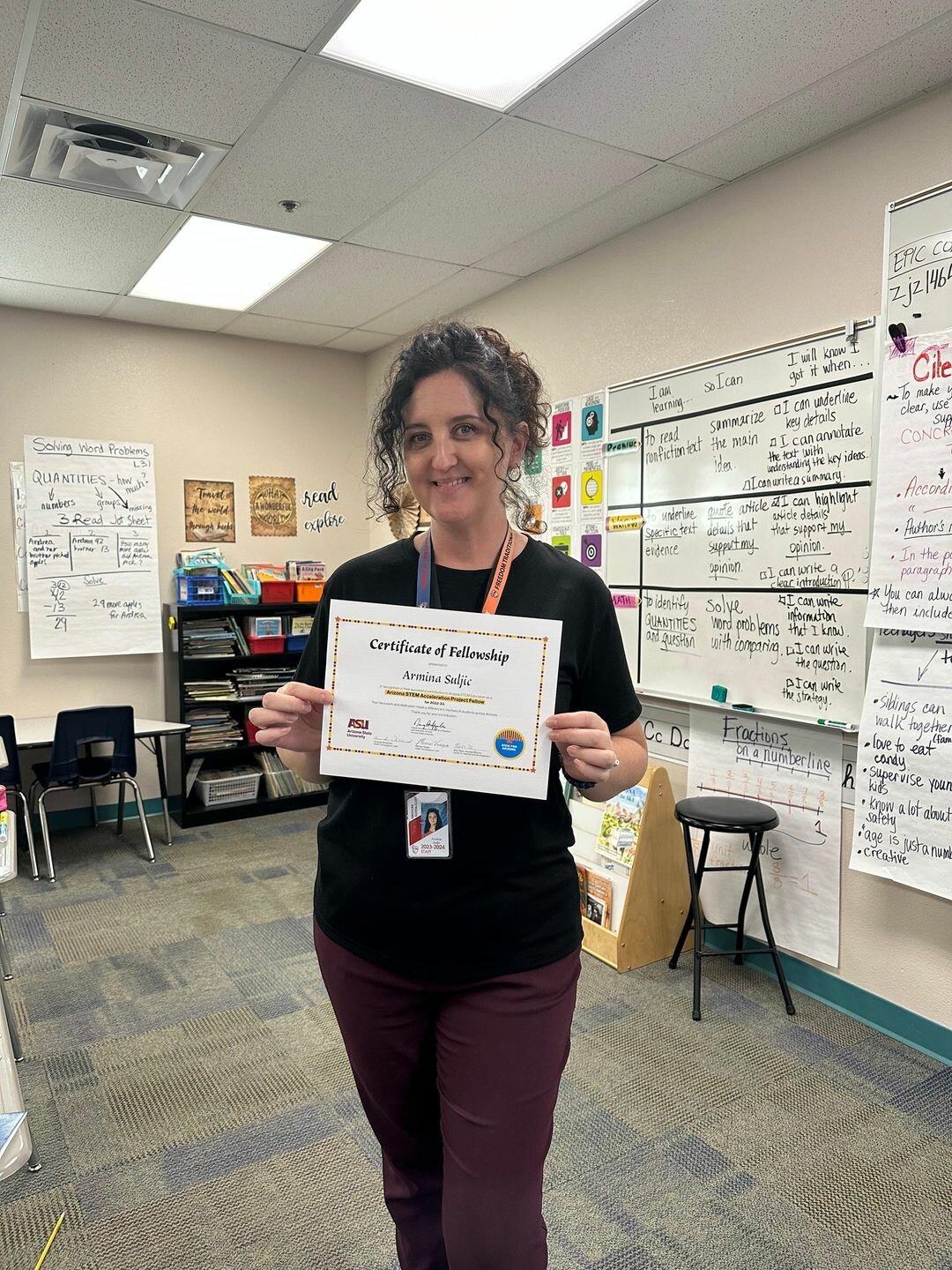 Freedom Traditional Academy teacher Armina Sulujic holds up a certificate of completion for her recent ASU STEM Acceleration Fellowship.