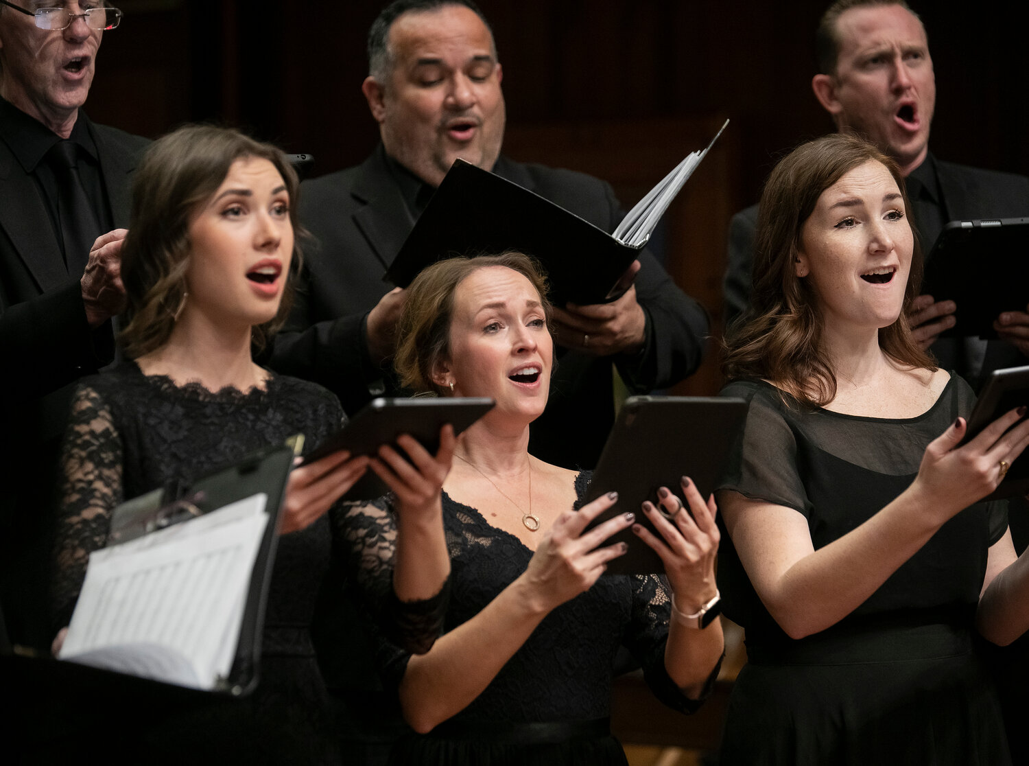 Sopranos sing with The Phoenix Chorale at a previous event.