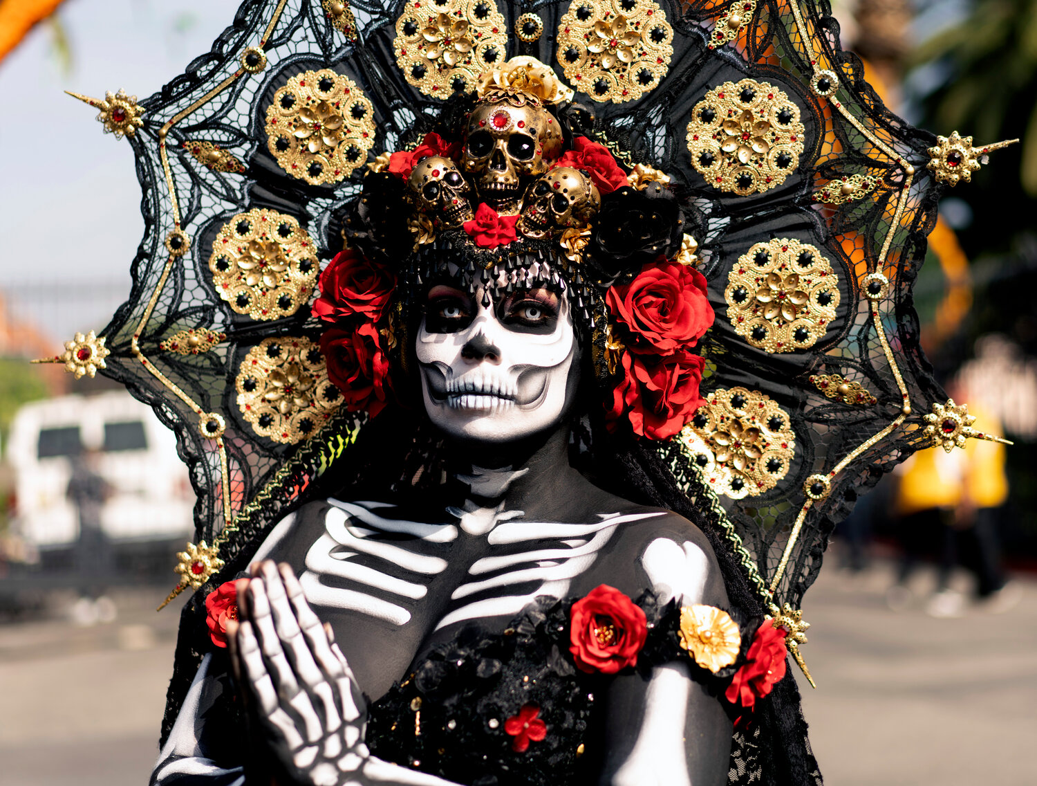 Dressed in traditional make-up and costume a woman participates in the celebration for the Day of the Dead, or Día de los Muertos, in this AP file photo.