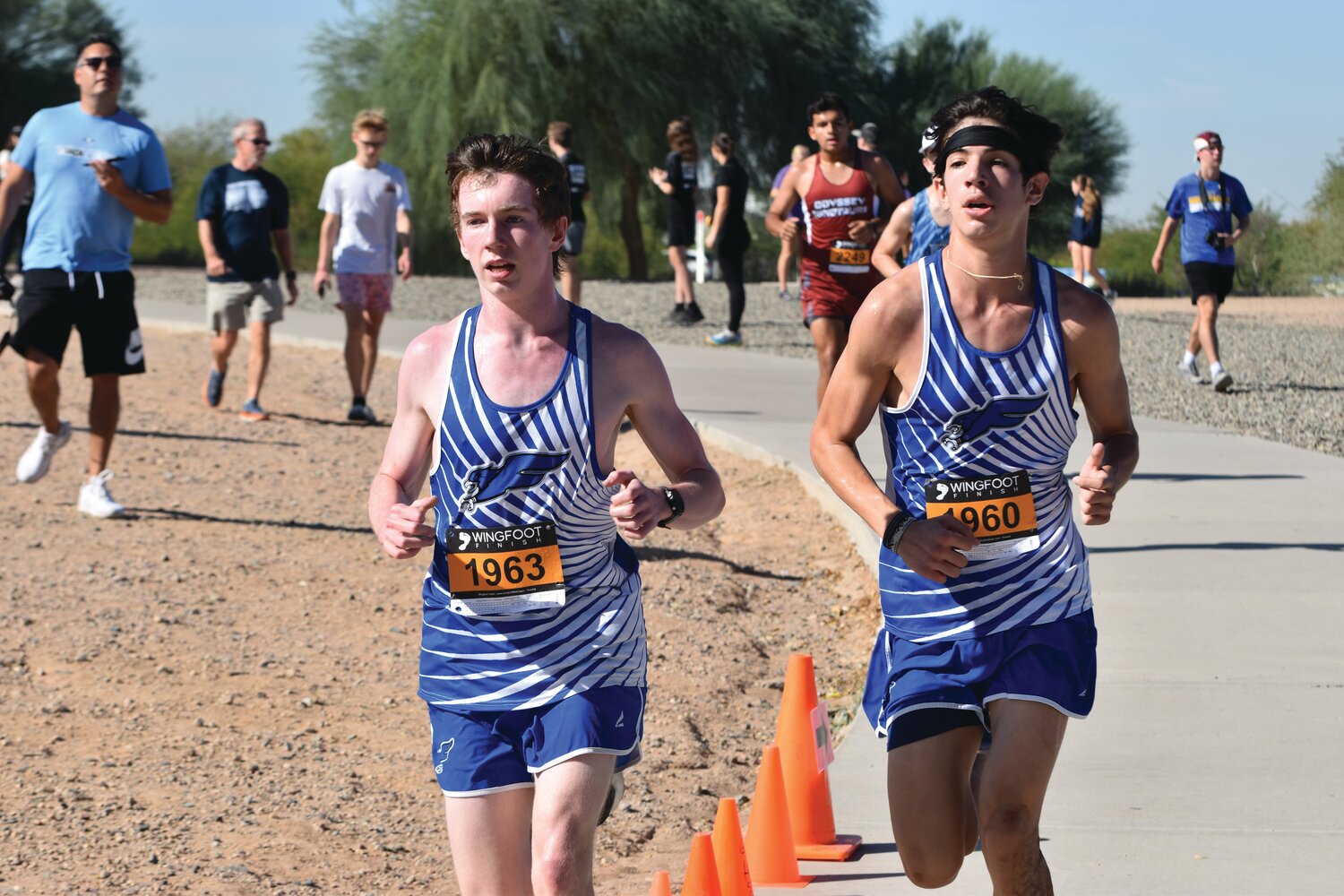Sophomore Colby Wright and senior Caleb Lara ran side by side for much of the sectional race, leading both to set personal records and finish two places away from each other. (Independent Newsmedia/George Zeliff)