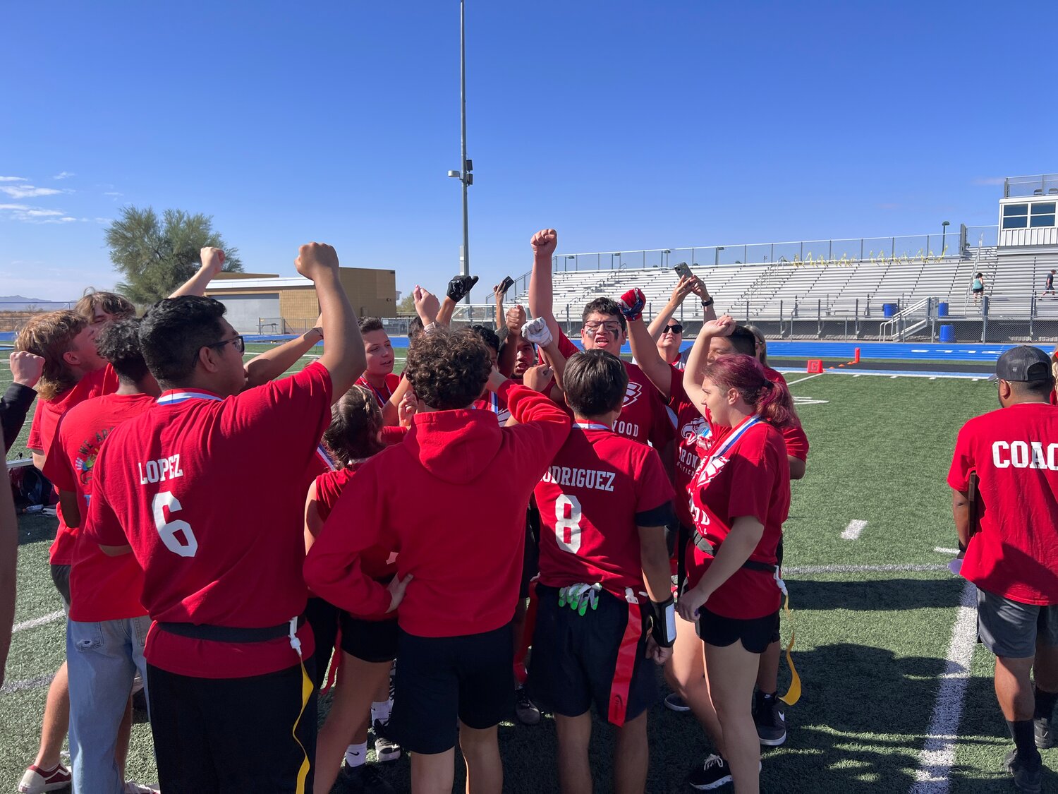 Ironwood's Unified Sport's flag football team celebrates winning the Silver Division state title Oct. 24 at Estrella Foothills High School In Glendale.
