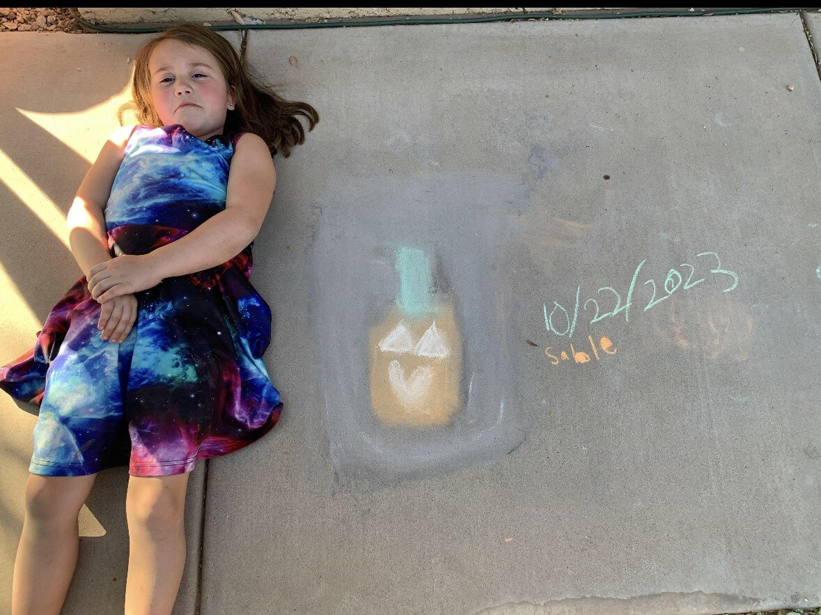 Sable Fallon, 6, won the Chalkers’ Choice award at the first annual Halloween Chalk Contest.
