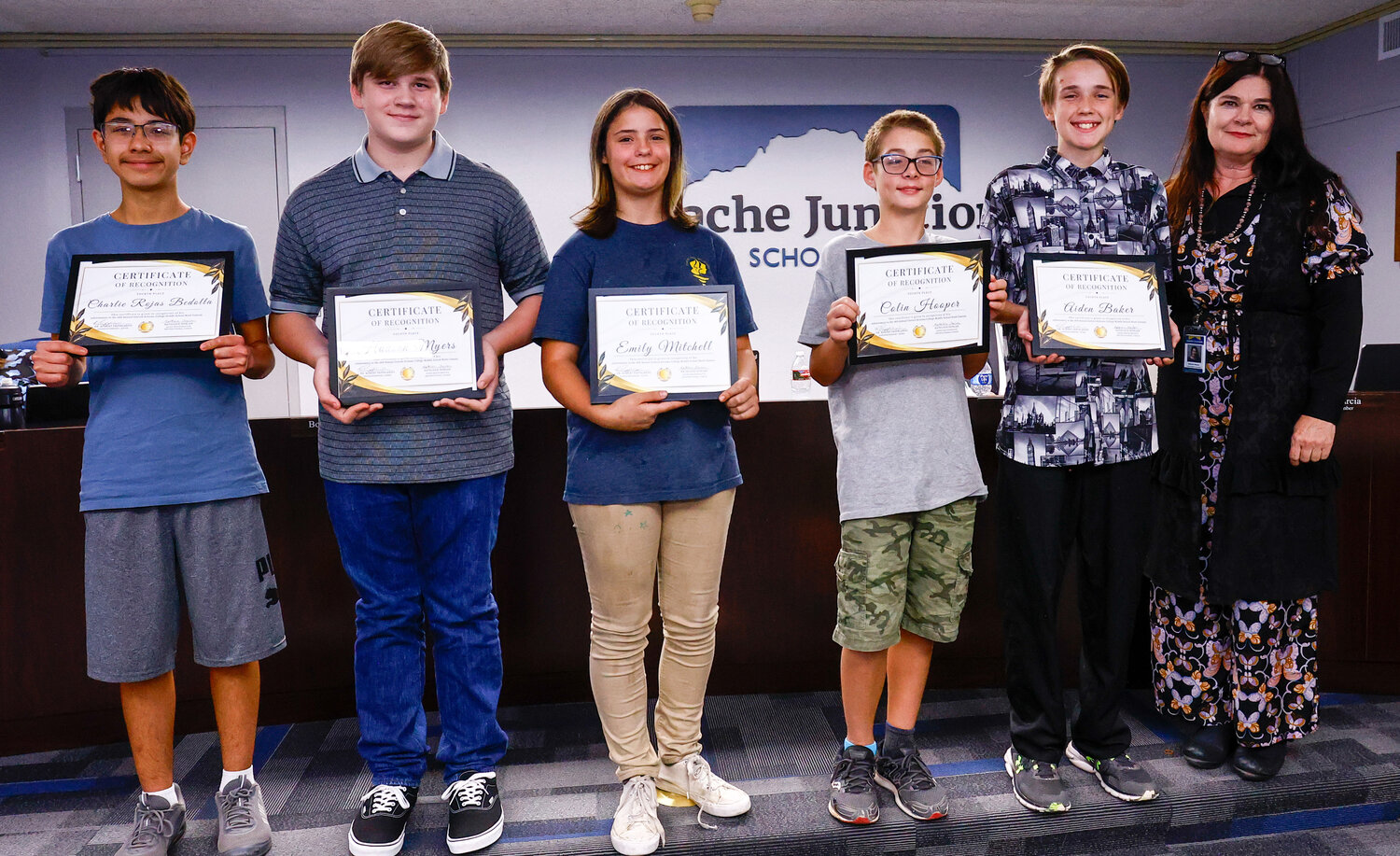 From left are math team members Charlie Rojas Bedolla, Hudson Myers, Emily Mitchell, Colin Hooper and Aiden Baker; and their coach, Kathleen “Ms. D.” Donlan.