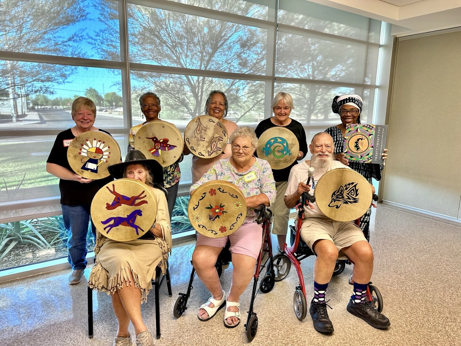 Dr. Lydia Woods, back row, far right, and Native American-style drum makers