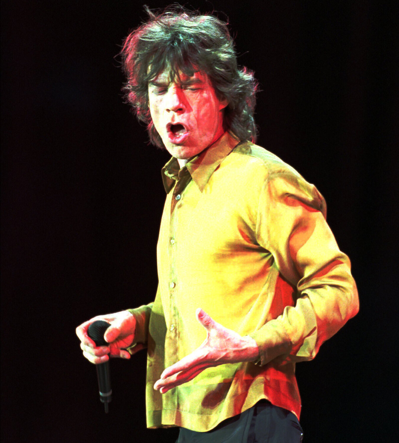 Mick Jagger of the Rolling Stones dances across the stage as the group plays Sun Devil Stadium on Nov. 7, 1997 in Tempe on their Bridges to Babylon tour.
