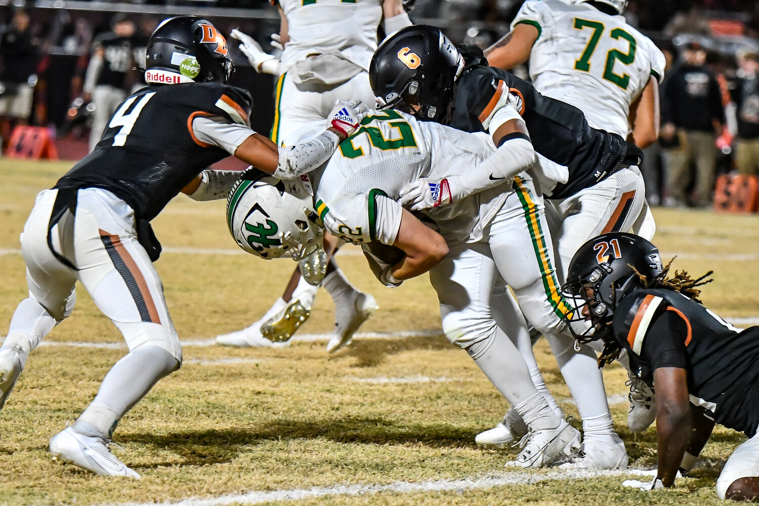 to bring down Horizon sophomore running back Bode Zamorano during the Scorpions' 18-15 victory in a 5A conference semifinal Nov. 24 at Desert Edge.