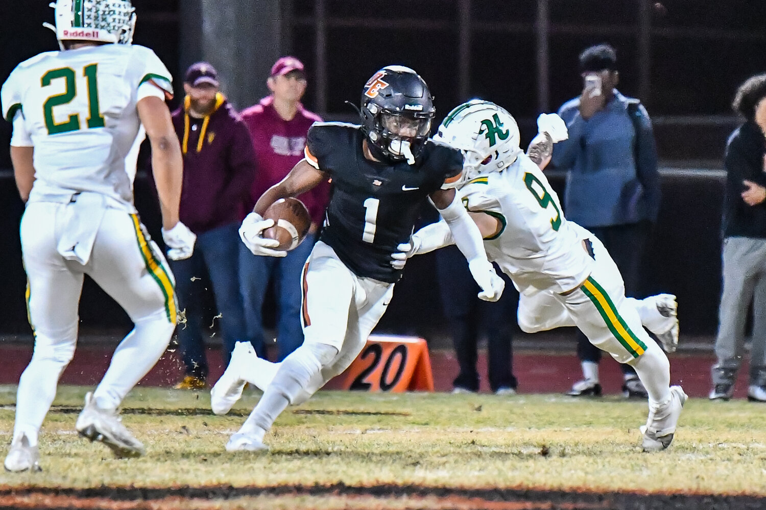 Desert Edge senir receiver Kezion Dia-Johnson cuts back trying to avoid the tackle of Horizon senior defensive end Jared Klopfenstein durin a 5A conference semifinal Nov. 24 in Goodyear.