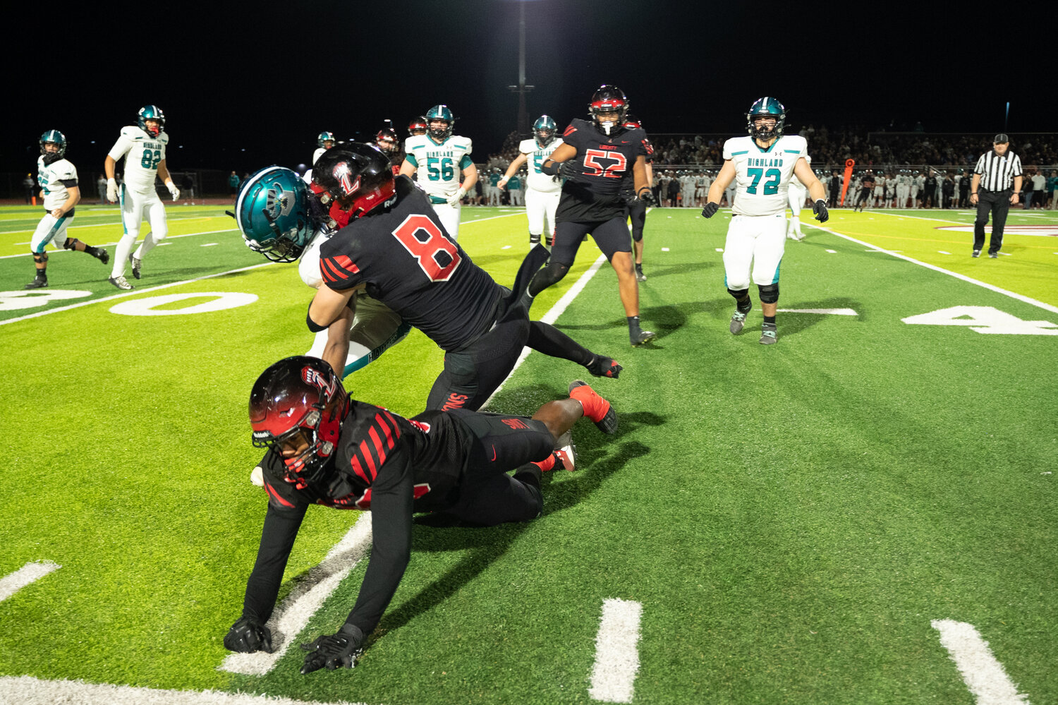 Liberty linebacker Keaton Stam (8) stops a Highland player in the Lions' 54-12 win on Saturday night in the Open Division Semifinals. (Courtesy Picture Lady Photography for West Valley Preps)