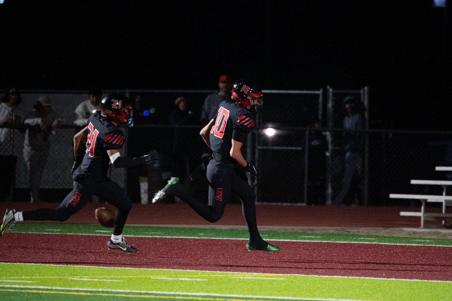 Zane Tallman (10) scores on a blocked punt for Liberty on Saturday night against Highland. (Courtesy Picture Lady Photography for West Valley Preps)