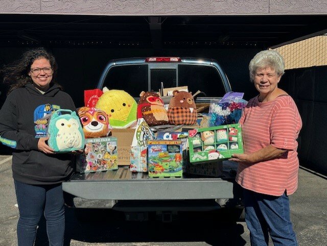 Frankie, left, from Eve’s Place, accepted a truckload of gifts and goodies from Jan Taylor, President of the Zumba Club of Sun City.