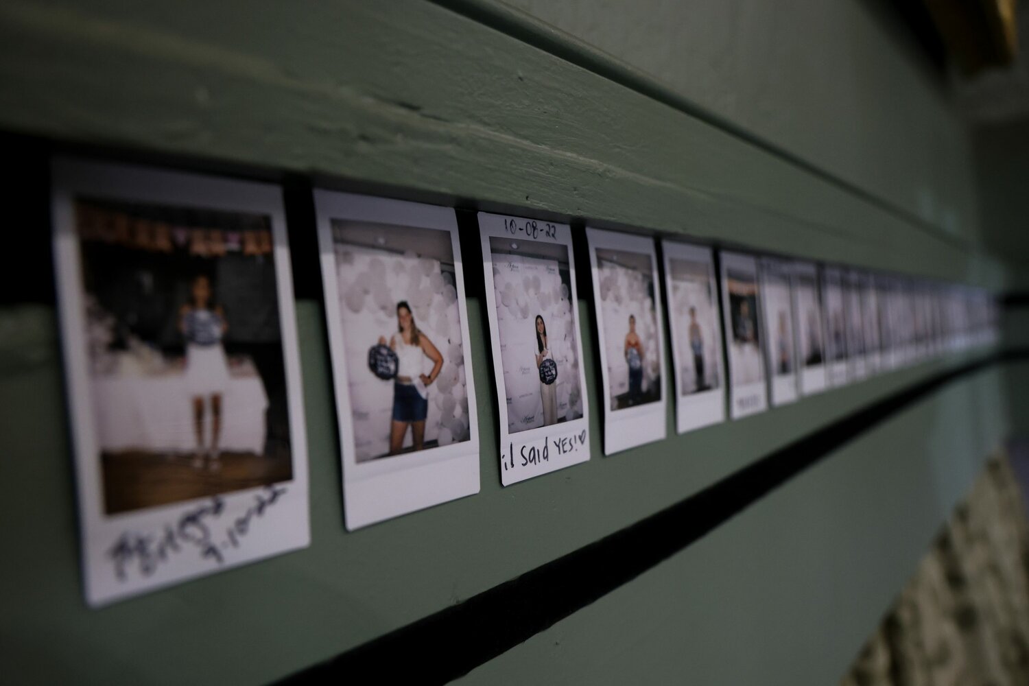 Photos of brides who bought their dresses from Azteca Bridal in Phoenix are displayed at the store on Nov. 21, 2023. (Photo by Sam Volante/Cronkite News)