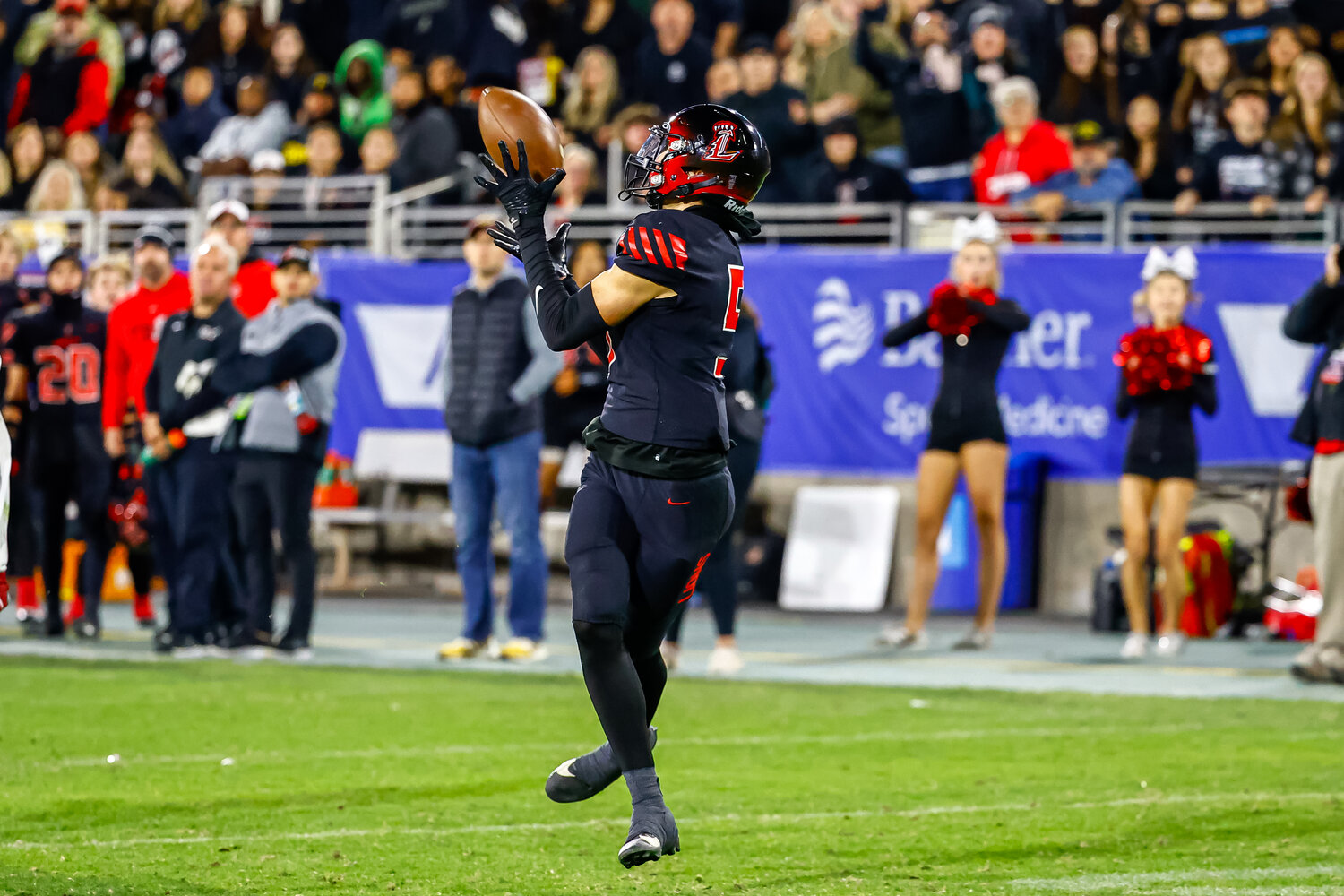 Liberty senior wide receiver Ryan Jezioro hauls in a touchdown catch on Saturday during the Lions' 33-21 win in the Open Division title game against rival Centennial. (Courtesy JJ Digos Photography/For West Valley Preps)