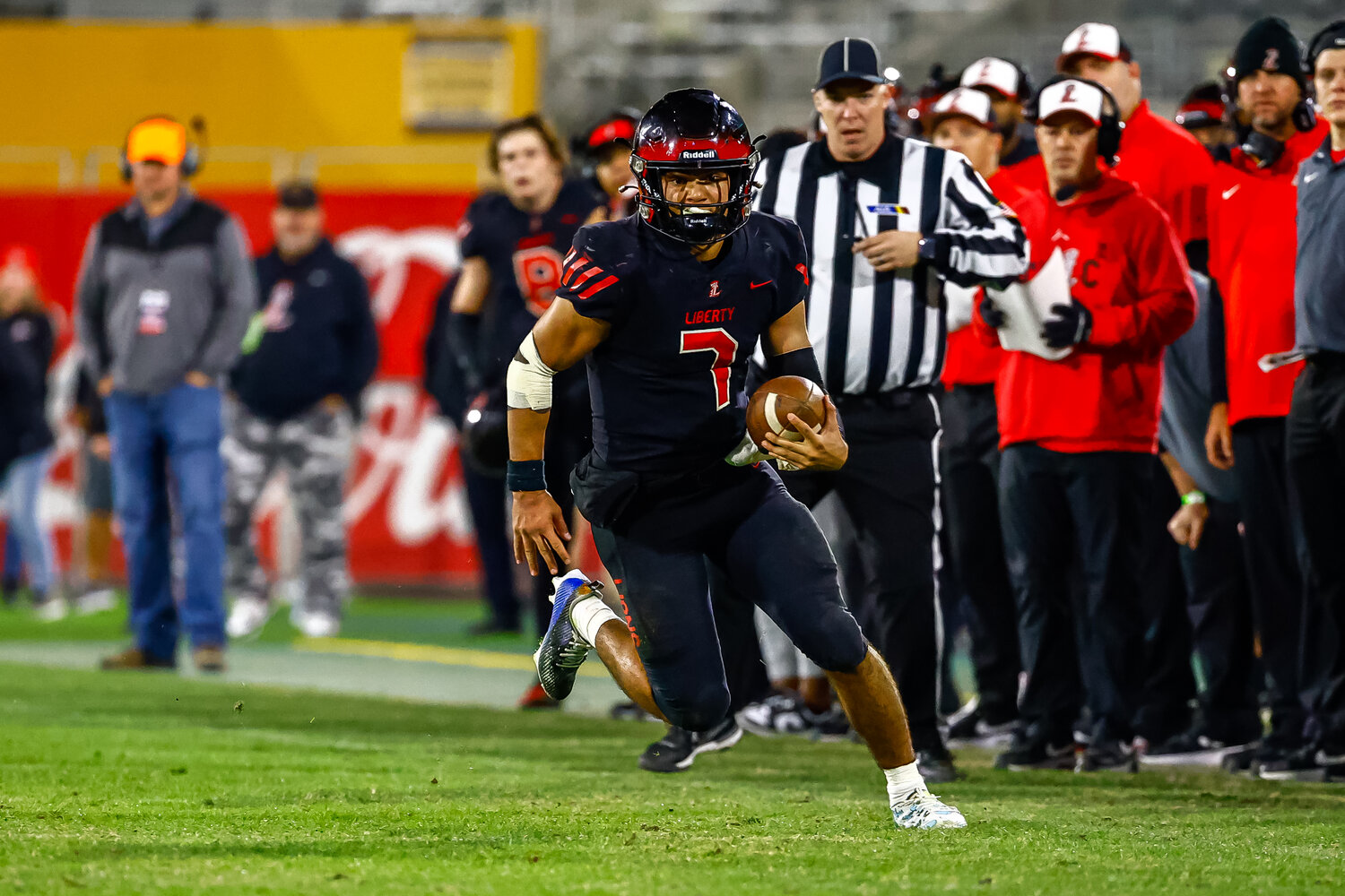 Liberty senior quarterback Navi Bruzon (7) runs for yardage in the Lions' 33-21 Open Division championship victory over Centennial on Saturday at Mountain America Stadium in Tempe. (Courtesy JJ Digos Photography/For West Valley Preps)