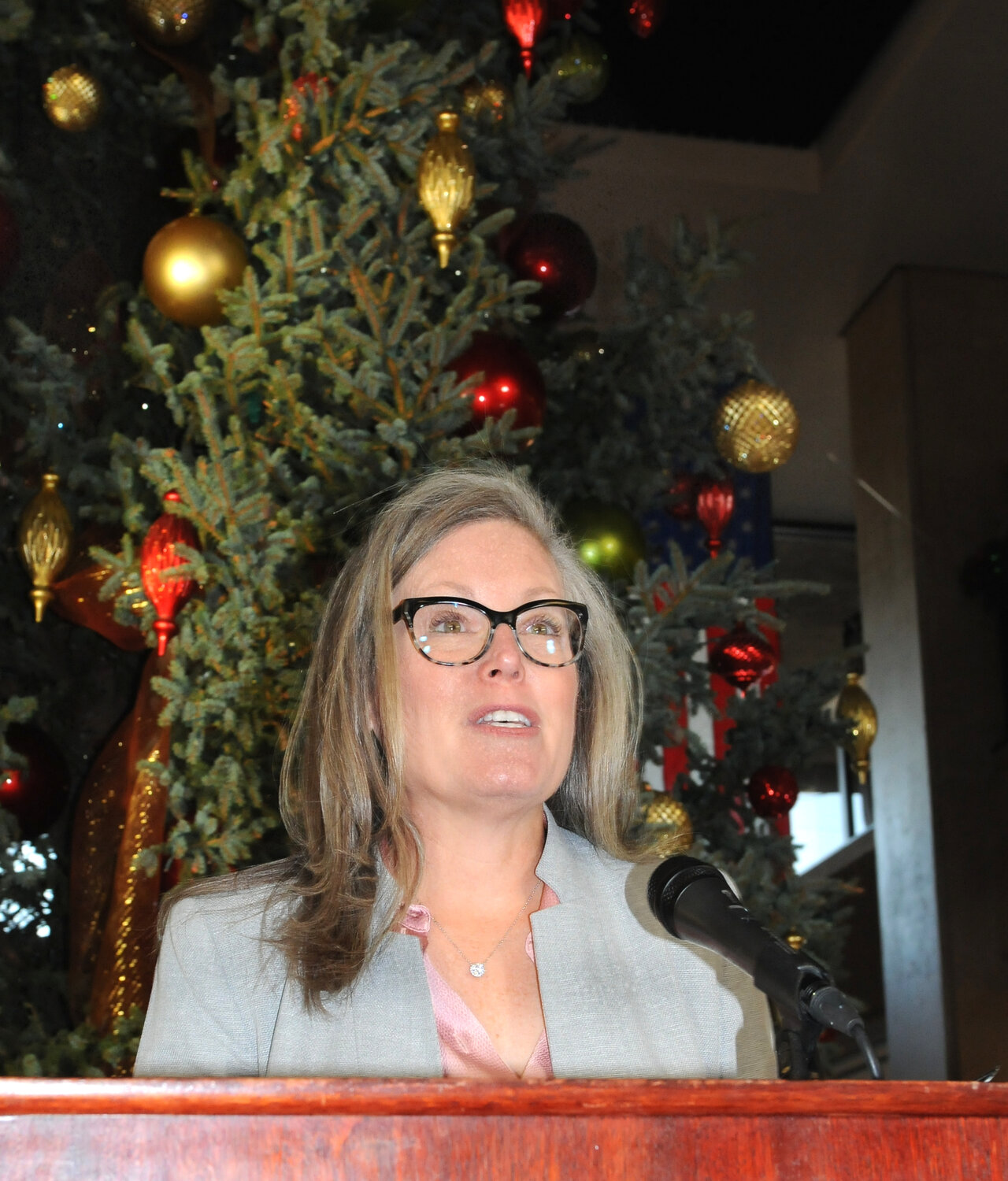 Gov. Katie Hobbs presiding at Monday's annual lighting of the Christmas tree in the Capitol tower. (Capitol Media Services/Howard Fischer)