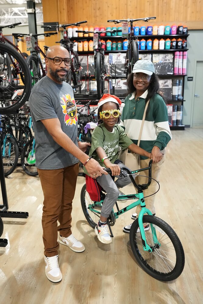 This daughter of an active duty military parent from Luke Air Force Base picks out a bike as part of a $300 holiday shopping spree at Dick's SPorting Goods in Arrowhead Towne Center on Dec. 7.