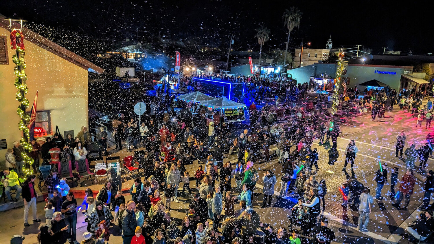 Snow, of the artificial kind, fell on Florence during the Hometown Holiday parade.