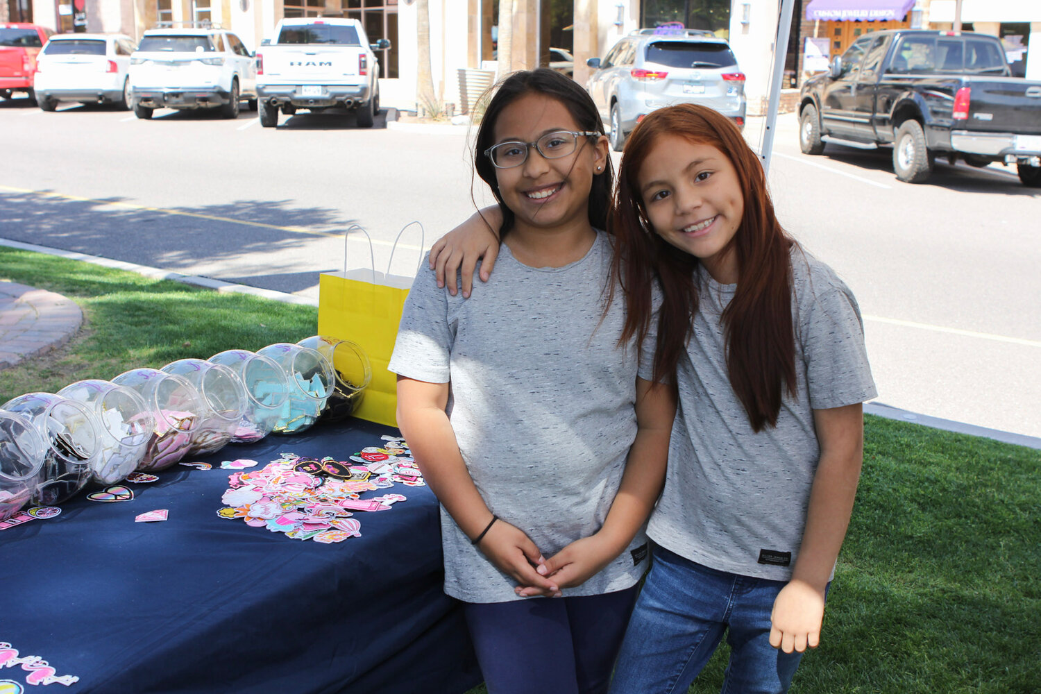 From left, Judith Garcia and Jade Garcia sell unique patches at the market.