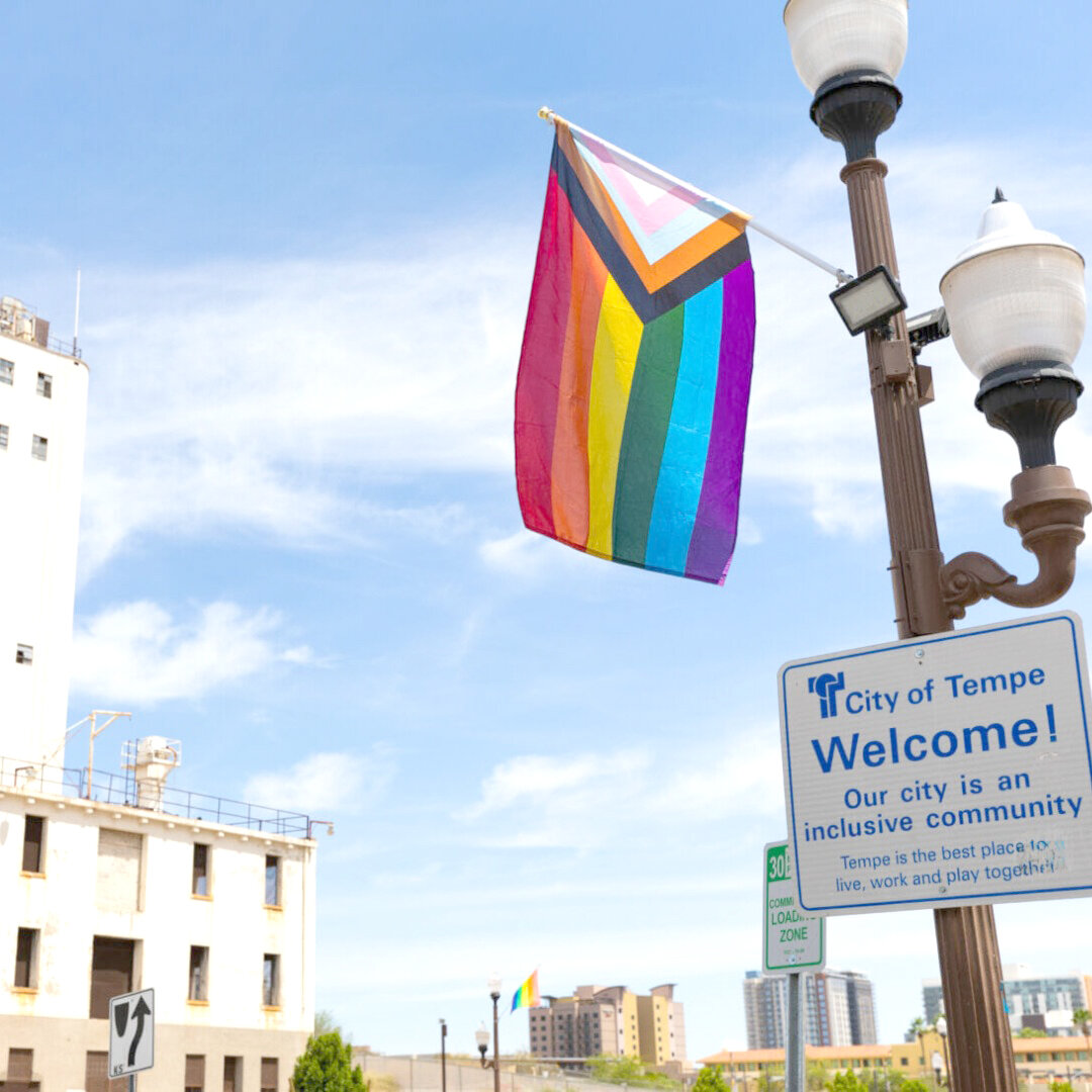 A flag is out in Tempe to recognize Pride month. While some of the Valley’s biggest Pride events are now held in October, there are still many events happening this month at night and at swimming pool venues.