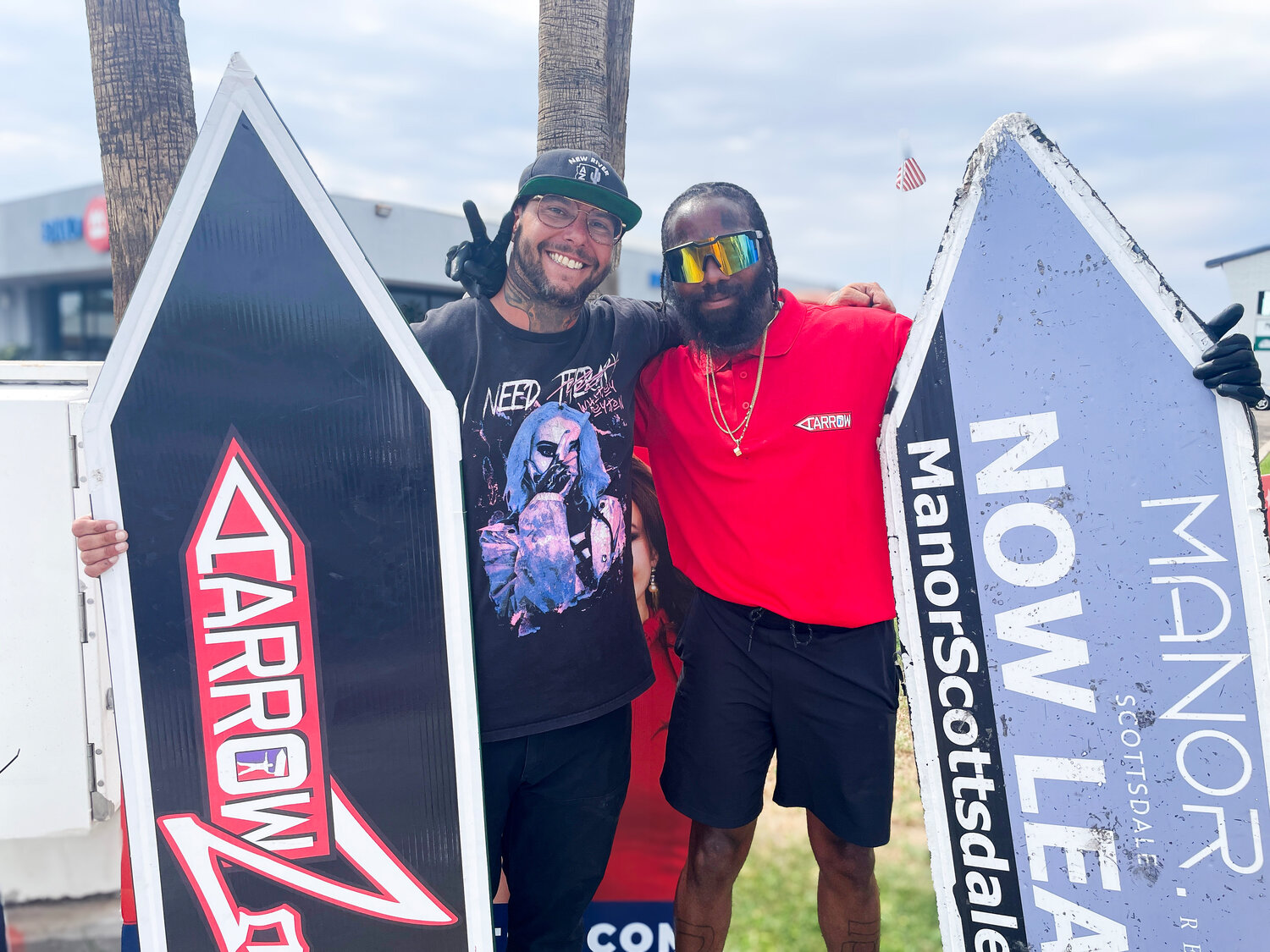 General manager for AArrow Sign Spinners Jacob Grigsby (left) with new sign spinner Laquan McDonald.