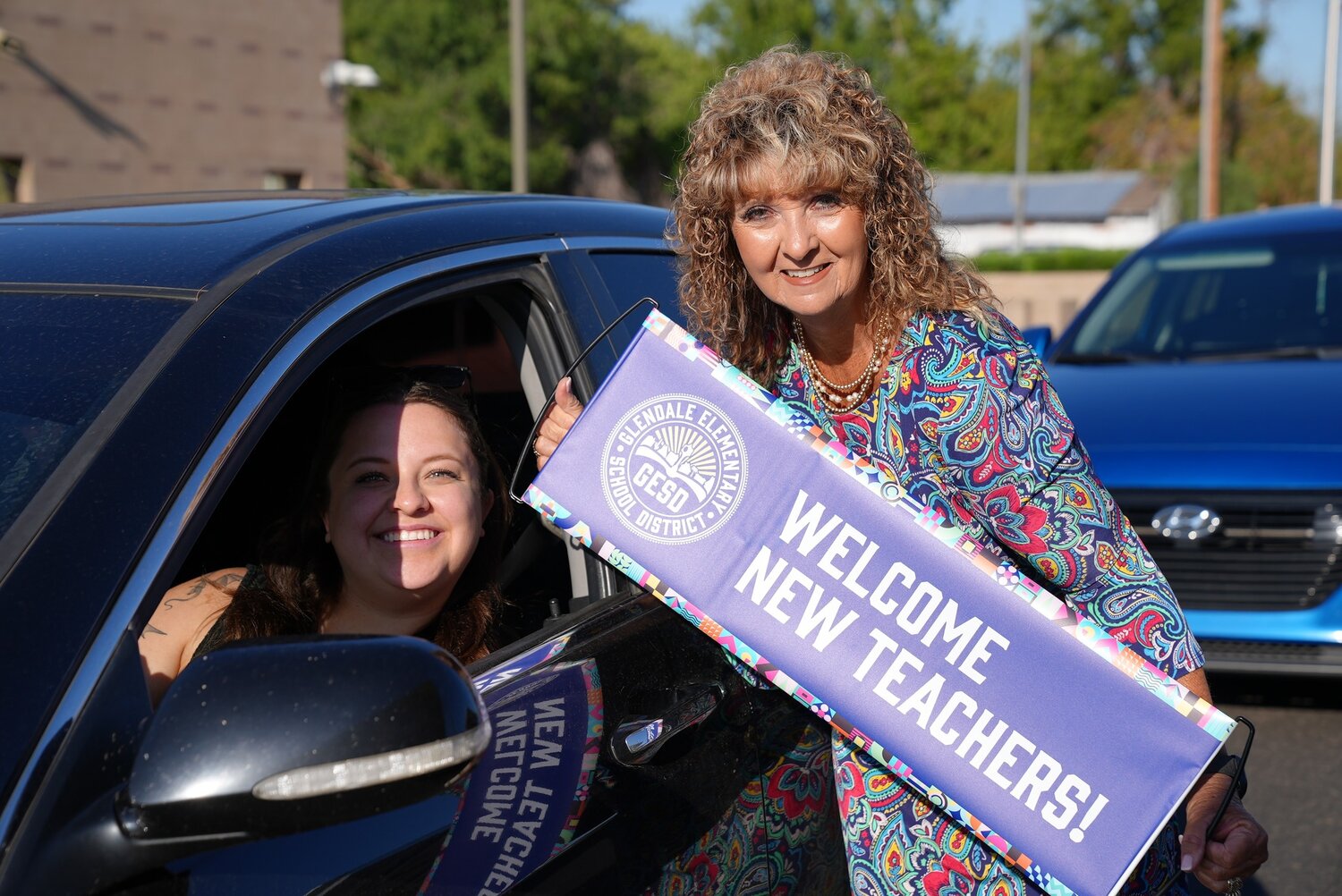 Glendale Elementary School District Superintenden Cindy Segotta-Jones, right, welcomes a new teacher to the district at a July 23 event.