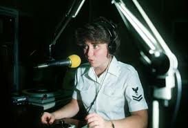 Petty Officer 2nd Class Paula Pedene at the microphone during a Far East Network broadcast.