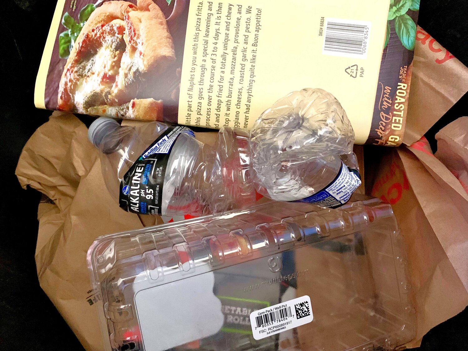 Co-mingled recyclables waiting to be picked up by a waste hauler in Sun City.