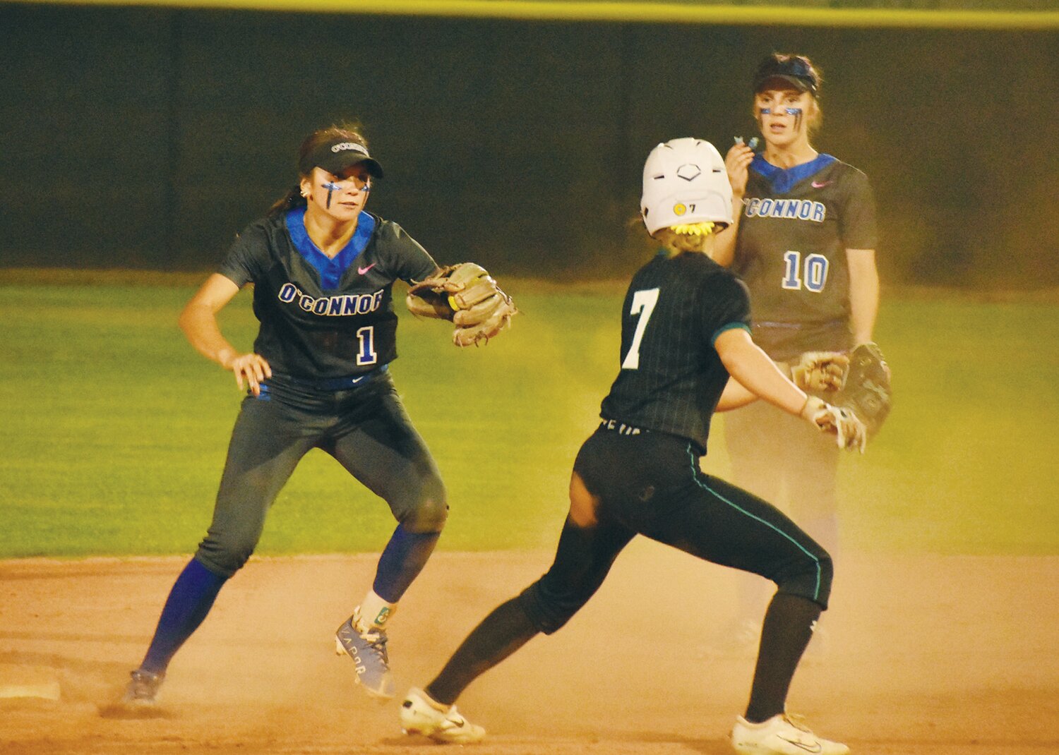 O’Connor Eagles shortstop Raegan Holtorf tags Highland baserunner Karsyn Norton in a sixth-inning play May 13. The Eagles won the elimination game, 7-2, to advance another day to face Xavier Prep.